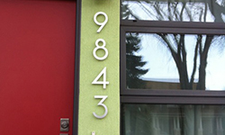 house numbers 9843 on green house